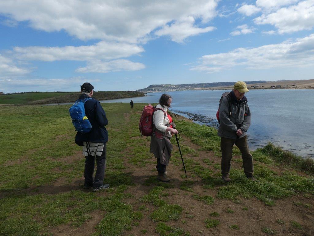 3 Walkers alongside the river